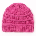 Detailed view of dark pink chunky knit texture and ribbed cuff on winter baby beanie - Rose Red