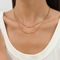 Dubbellaagse gouden ketting met horizontale kruishanger aan fijne kralen- en schakelkettingen - Goud (K-024)