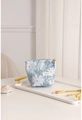 Close-up of blue jacquard makeup bag with white floral patterns and golden zipper - Blue White Floral