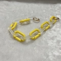 Detail of yellow and matte transparent acrylic chain links with a golden metal ring clasp - Frosted Yellow