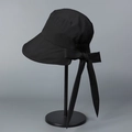 Detail view of large rear bow and long ribbons on black UV protection sun hat - M (56-58cm) / Black