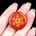 Handheld 25mm red agate stone disc with golden Metatron's Cube sacred geometry engraving - Red Jasper