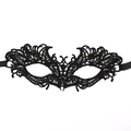 Detailed close-up of intricate black lace masquerade mask with symmetrical floral patterns - New Phoenix