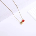Detailed close-up of gold chain necklace with red heart pendant and number 0 charm - Heart Letter Necklace O