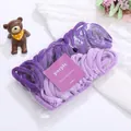 Close-up of assorted purple gradient seamless cotton towel hair ties with bear decor - Purple
