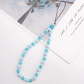 Ciondolo per cellulare con perline blu a stella e cuore con cordino marrone su bianco - Pentagramma Blu