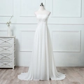 Elegant strapless wedding dress with intricate floral lace bodice and layered chiffon skirt - US size 2 (S) / Ivory