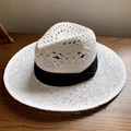 White hollow-woven straw sun hat with wide flat brim and black decorative ribbon - Hollow White Panama Hat - Black Ribbon