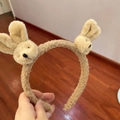 Close-up of soft light brown plush headband featuring two cute rabbit animal decorations - Headband-Brown Bunny