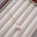 Minimalist 18K gold chain necklace with a single 10mm round white pearl pendant - Necklace / 10mm / Cream