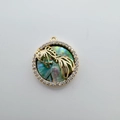 Macro shot of 18K gold fish pendant with abalone shell inlay and diamond accents - Koi (Abalone Shell)