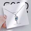 Close-up of crescent moon staff pendant with blue galaxy stone and zircon inlay - 1183 Moon Star Scepter Pendant Necklace