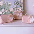 Pink leather-textured wedding favor gift bags with gold bead handle and love ribbons - Pink