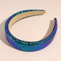 Close-up of wide headband with shiny blue and green sequins and soft beige lining - Dark Blue