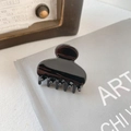 Classic glossy black resin hair claw clip for elegant hairstyles on artistic book background - 4cm / Black