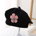 Detail of black knitted baby beret featuring a 3D pink corduroy flower decoration - 3-48 Months / Black