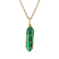 Macro view of wire-wrapped green malachite hexagonal prism pendant on gold chain necklace - Synthetic Malachite (with chain)