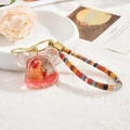 Capybara red quicksand keychain with bear and strawberry in Mickey-shaped bottle - Strawberry Bear Quicksand (Lanyard Style) / Bear
