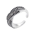 Close-up of luxury crisscross adjustable ring with black pave-set zircons on silver metal - Platinum Black Zirconia