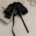 Elegant black satin ribbon hair clip with rose decoration on a linen book background - Black Rose Satin Ribbon / Black