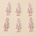 Lot de six pendentifs têtes de mort en émail doré et blanc pour bijoux d'Halloween - Corps de Squelette Or & Blanc