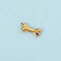 Golden bone-shaped metal pendant with a blue round zircon inlay and hanging loop - Gold September
