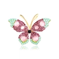Gouden vlinderbroche met roze en muntgroene strassteentjes op witte achtergrond - Roze en Groen