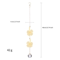 Detailed view of golden metal four-leaf clover suncatcher with faceted crystal ball - Four-Leaf Clover