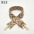 Detail of adjustable beige and brown herringbone bag strap with gold metal hooks - Brown