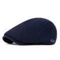 Men's retro dark blue waffle knit newsboy cap with side metal brand logo detail - Navy Blue