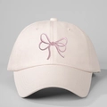 Detailed view of the purple bow embroidery and cotton twill fabric on the pink baseball cap - Beige