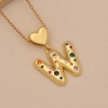 Macro shot of gold necklace with letter W pendant and colorful zircon heart buckle - Letter W / Gold