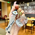 Milk tea cup keychain with liquid floating beads and sweet heart wrist strap charm - Cloud Strap Grey Luminous Dried Flower Cup