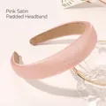 Detailed view of pink padded satin headband with non-slip inner lining on a glass bowl - Pink