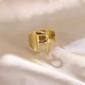 Adjustable golden stainless steel ring featuring a polished letter R on satin background - Letter R / Gold