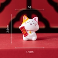 Miniature white resin lucky cat figurine holding Zhao Fu scroll, size 2.6cm by 1.9cm - Cat Holding Blessing