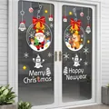 Dettaglio di adesivi statici con Babbo Natale e renne su porta in vetro con auguri di Natale - AMJ959 (105x75cm)