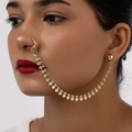 Golden heart-shaped nose ring with ear chain connector on fashion model - Gold Heart Style