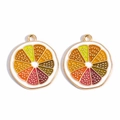 Detailed close-up of golden alloy citrus fruit pendants with colorful enamel inlay - Lemon Slice