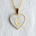 Gold heart necklace with shell inlay and letter C pendant on white linen background - Letter C / Gold