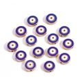 Macro detail of 10mm gold Evil Eye beads with blue enamel inlay for DIY jewelry making - Round / Sapphire Blue