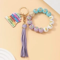 Detail of beaded teacher keychain with purple tassel and engraved wooden book pendant - Purple Tassel Style