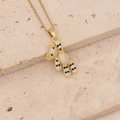 Close-up of a gold bear pendant with sparkling white and black cubic zirconia stones - Black and White Zircon Bear (3#)