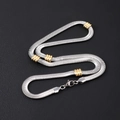 Flat silver mesh chain necklace with golden beads and lobster clasp on black background - 6mm Flat Snake Chain With Gold Beads Necklace