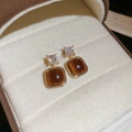 Detailed view of 18K gold plated earrings with brown tiger eye stone in a jewelry box - 44# Silver Earring Post - Gold Coffee