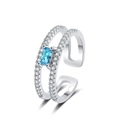 Double-layered silver ring with pavé stones and emerald-cut blue gemstone on white background - White Gold Color-Blue Zirconia