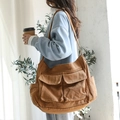 Brown canvas messenger bag with multi-pocket utility design for casual daily wear - Brown