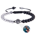 Macro shot of custom photo projection bead on adjustable black and white beaded bracelet - White Crystal + Frosted Stone