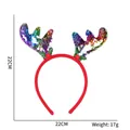 Detail of Christmas headband with colorful sequined antlers and green leaf accents - Red Reindeer Horns