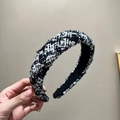 Close-up of black and white tweed wide headband showing woven fabric texture and details - Black + White + Blue Mixed